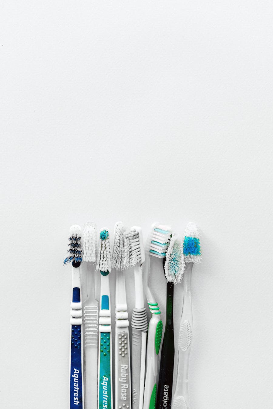 A flat-lay of colorful toothbrushes
